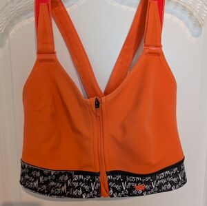 SHEFIT Women's Flex Medium Impact Sports Bra in Believe Orange